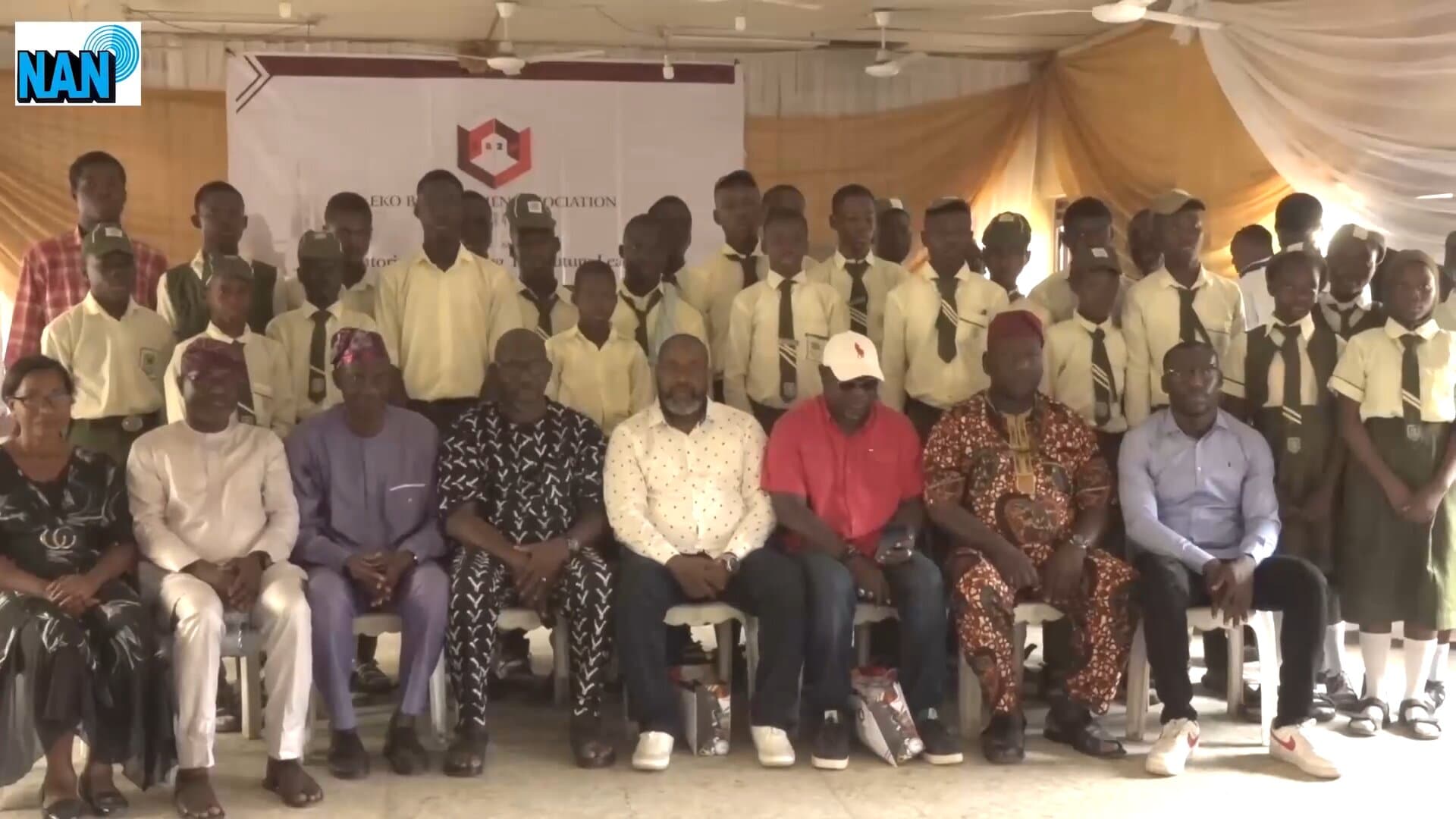 Eko Boys to Men Association members seated with students at the ICT skills engagement