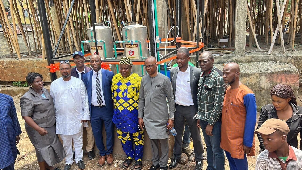 Eko Boys To Men members and guests posing for a group photo at the water project commissioning